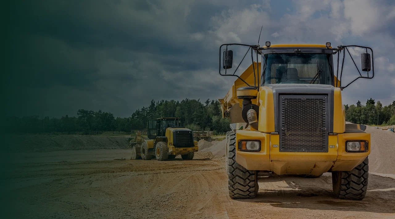 Agricultural tractor, excavator, and compact track loader ready for work
